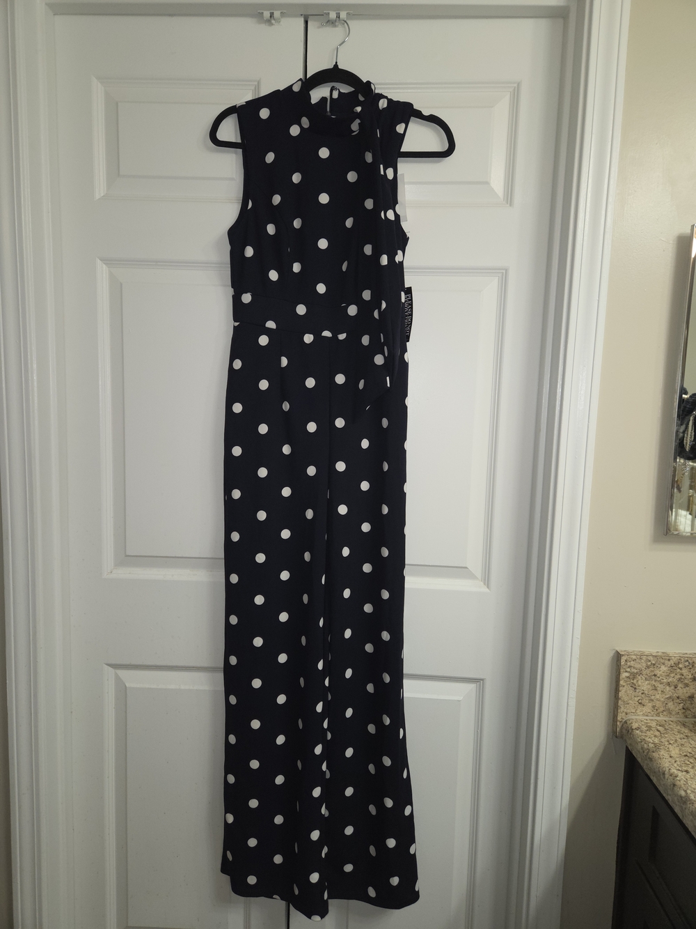 New York & Company Navy and White Polka Dot Sleeveless Jumpsuit Tie Neck